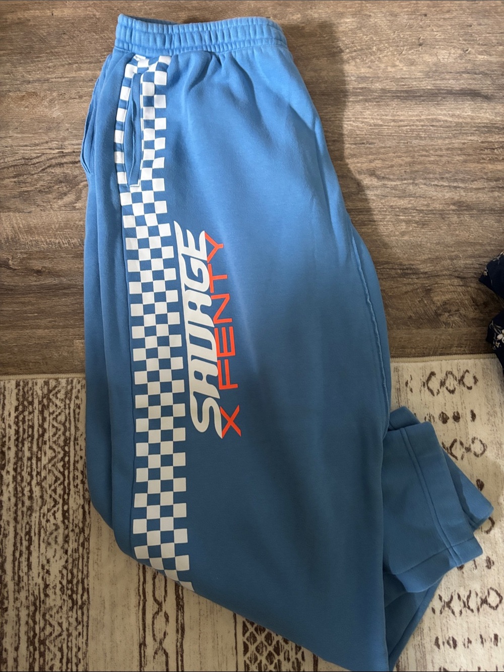 Savage X Fenty Blue Track Joggers with White Checker and Orange Logo